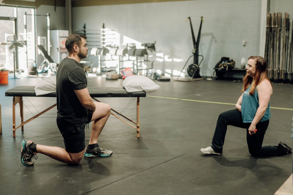 physical therapist talking with client