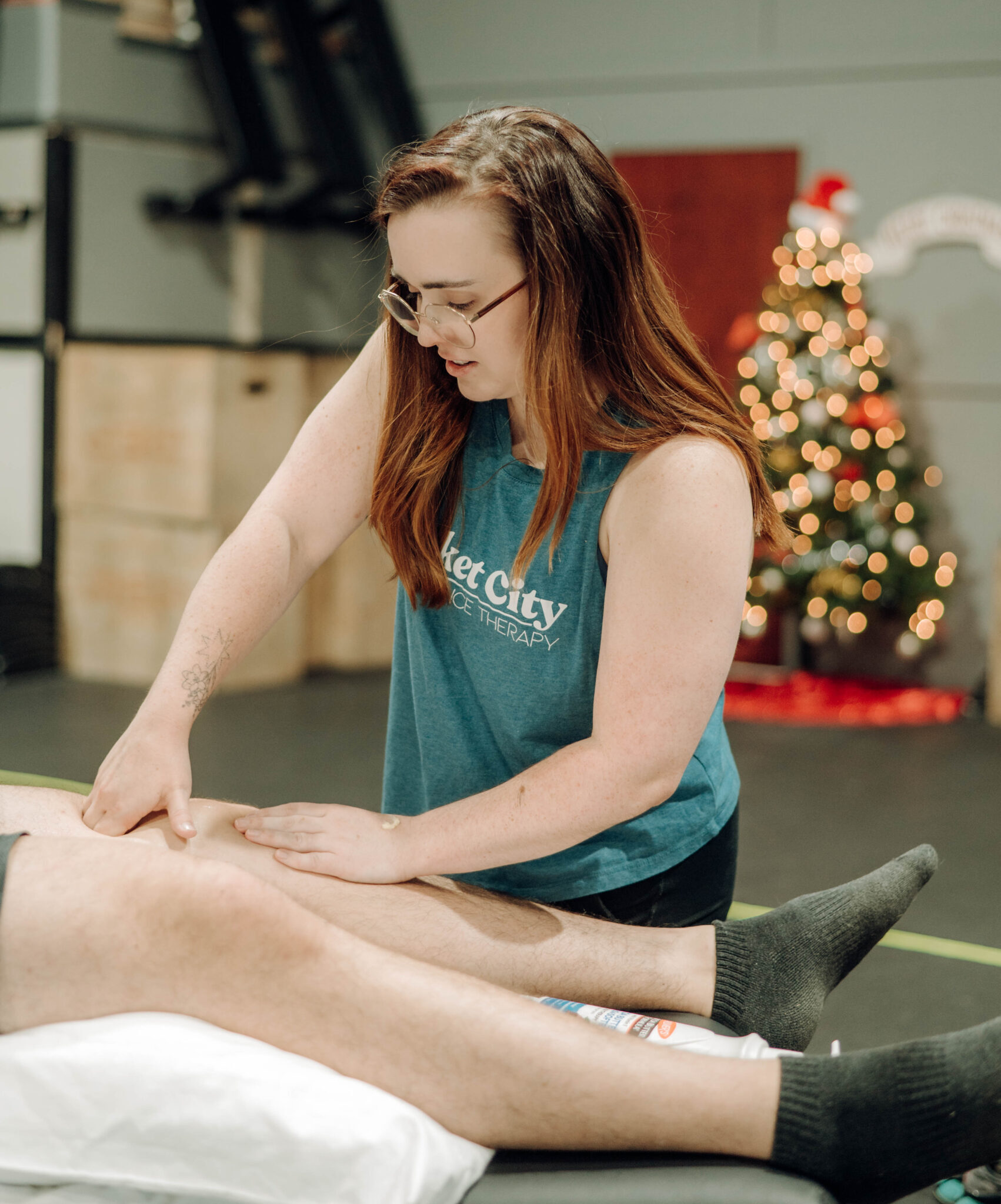 physical therapist providing manual therapy to patients knee