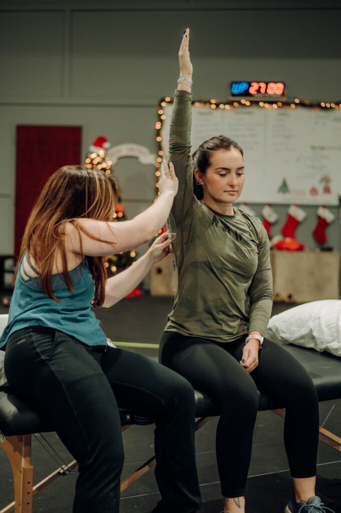 physical therapist measuring shoulder ROM